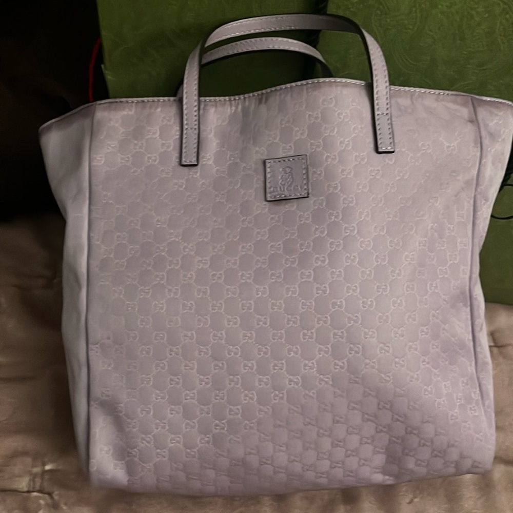 Unique purple color authentic gucci bag minor flows but still good